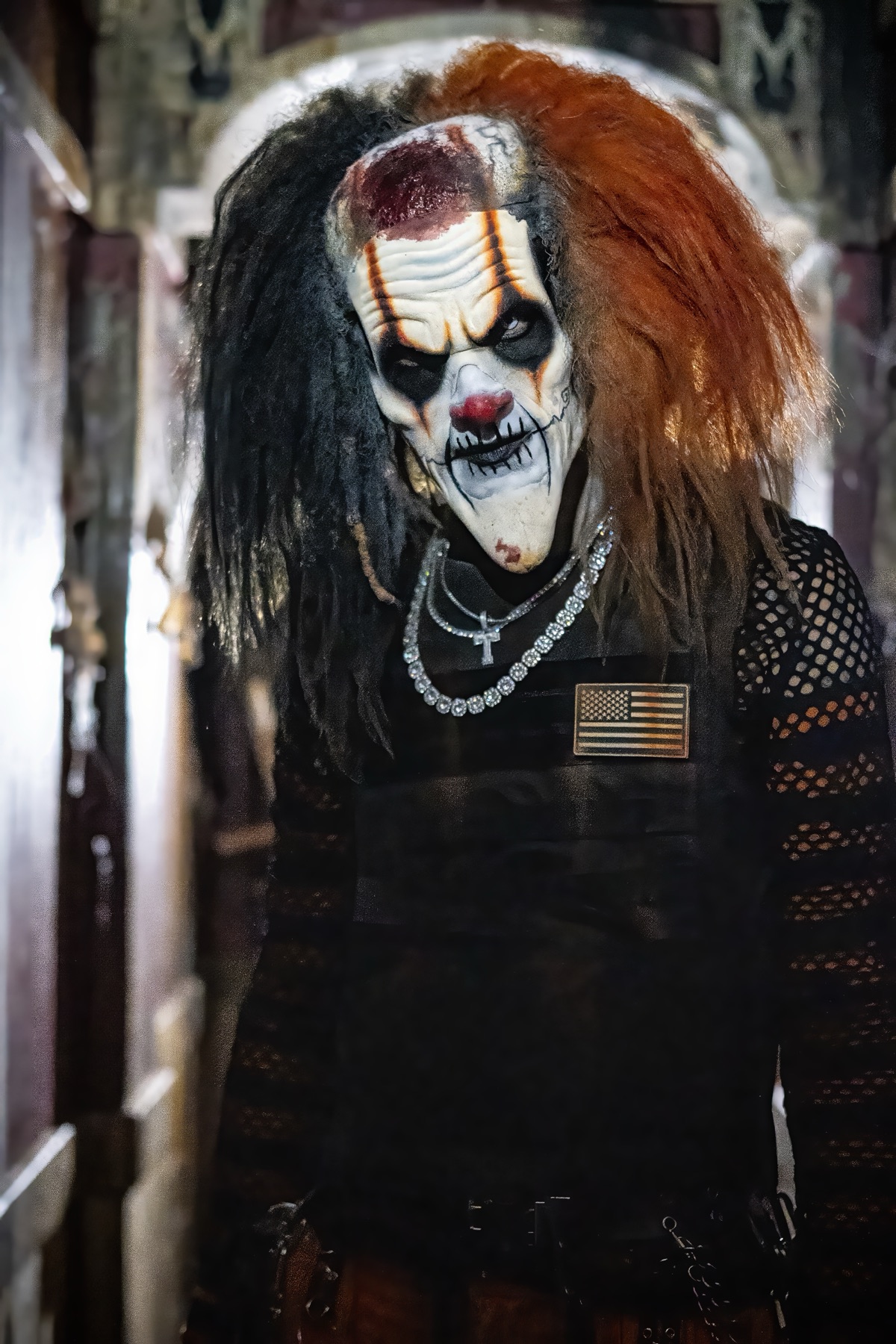 Trip the clown in his black and orange costume